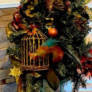 Vintage Artificial Christmas
24×13" Tree w gold birdcage, bird w feathers. 1956